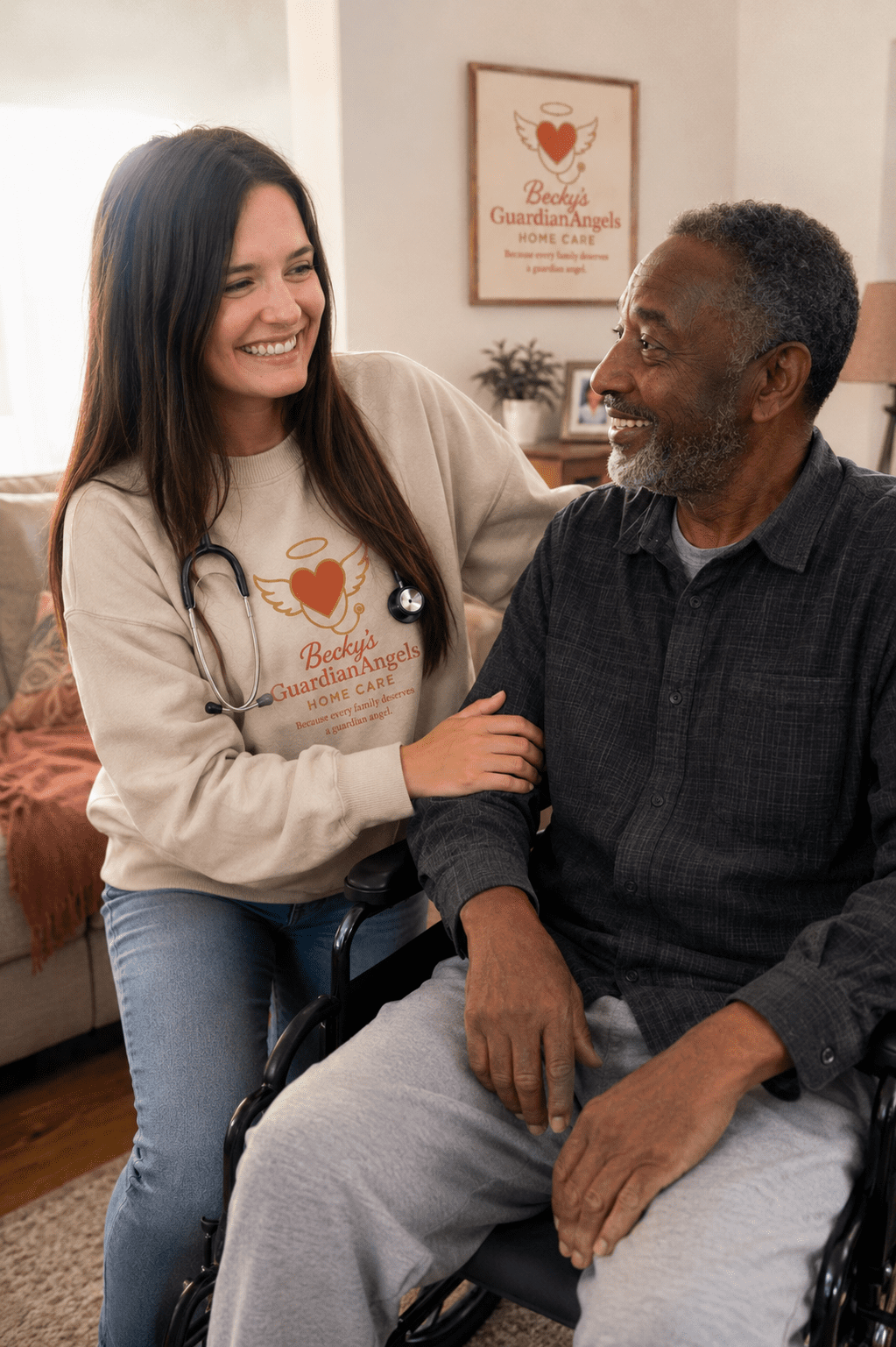 Caregiver smiling with elderly man in wheelchair