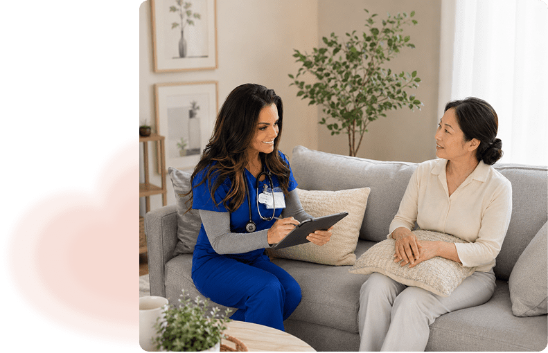 Nurse in blue scrubs consulting older woman